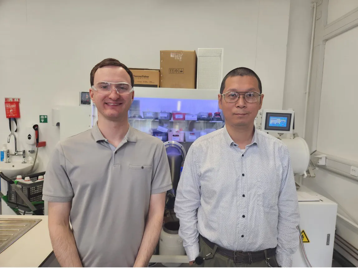 EPSRC NRF for EPR team members in front of a machinery in their lab
