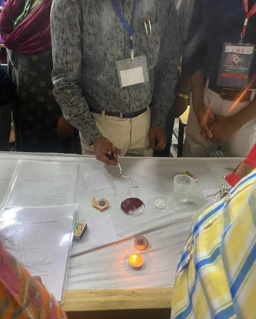 A man prepares to do an experiment featuring a match