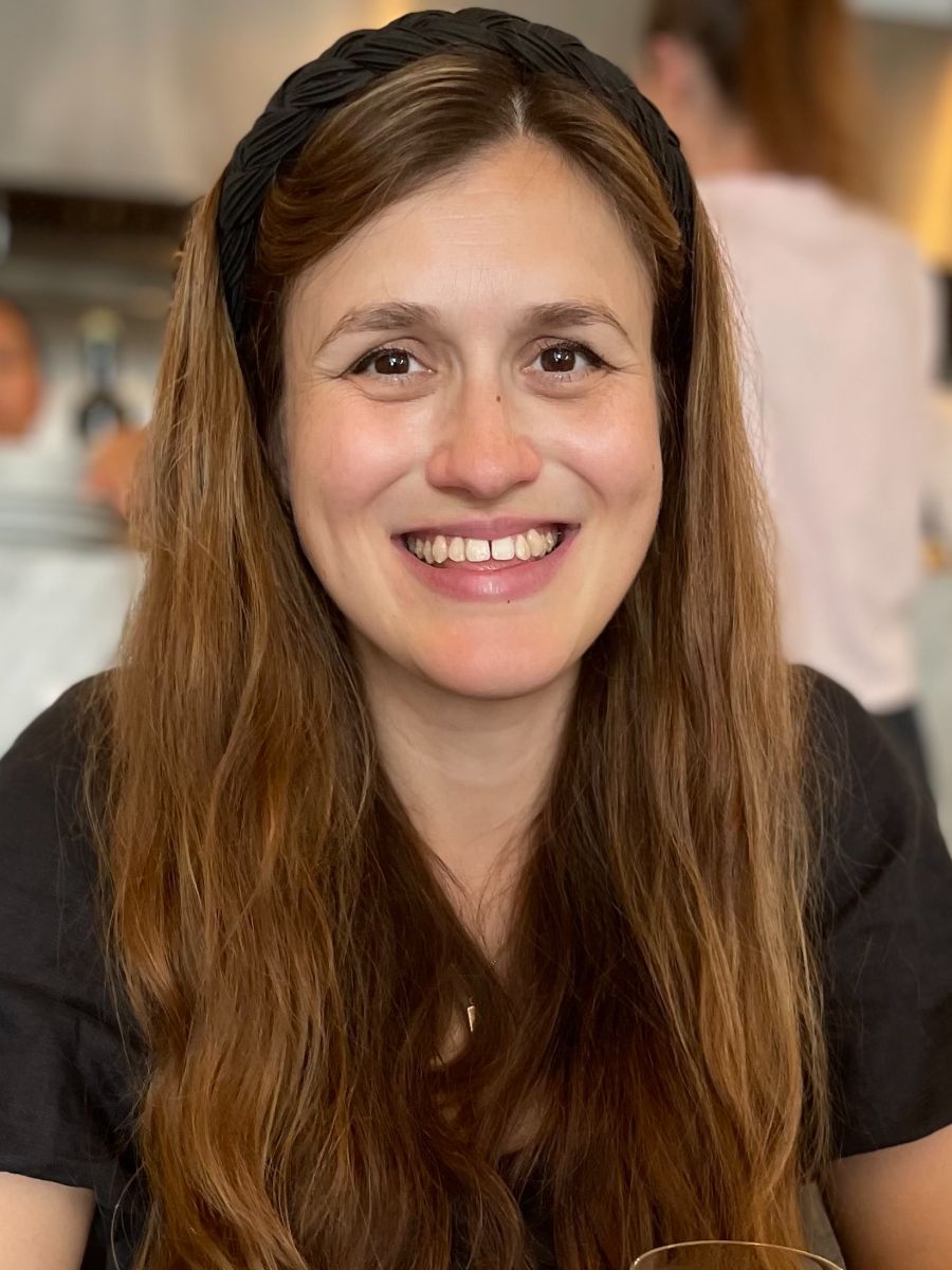 Dr Clare Bakewell smiling at camera