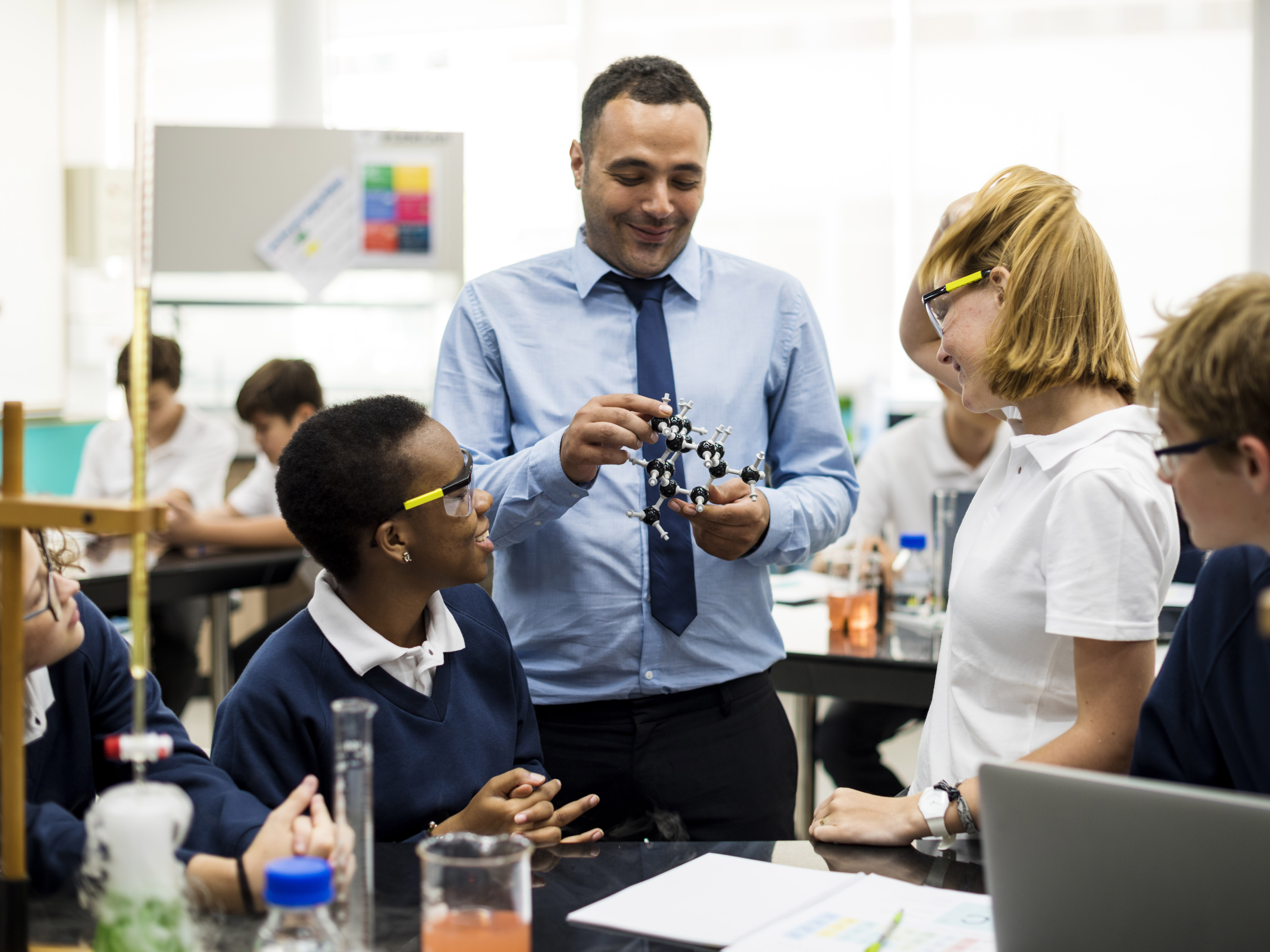 teacher with older children in classroom