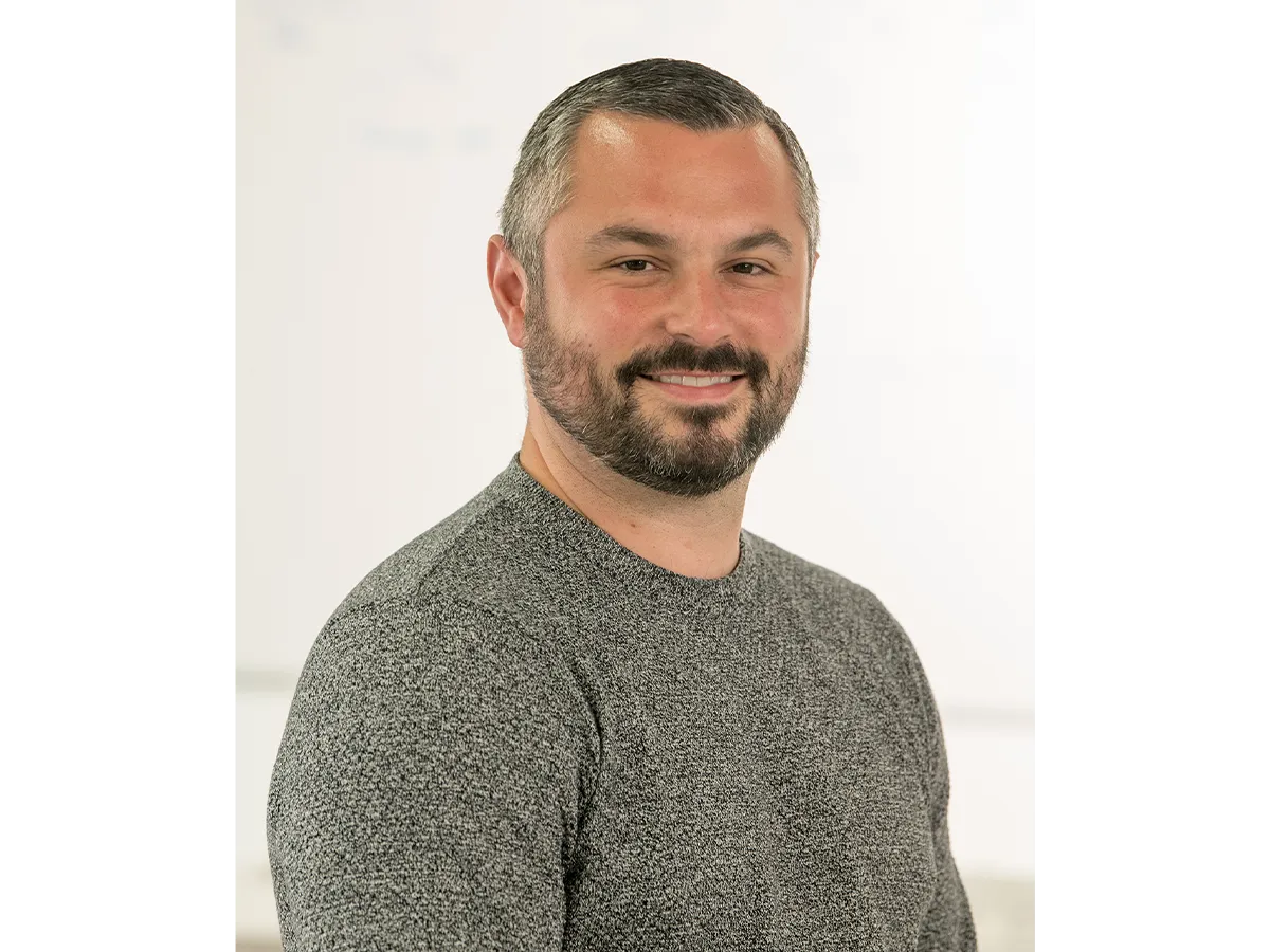 Dr Graeme Turnbull with a beard, in grey jumper