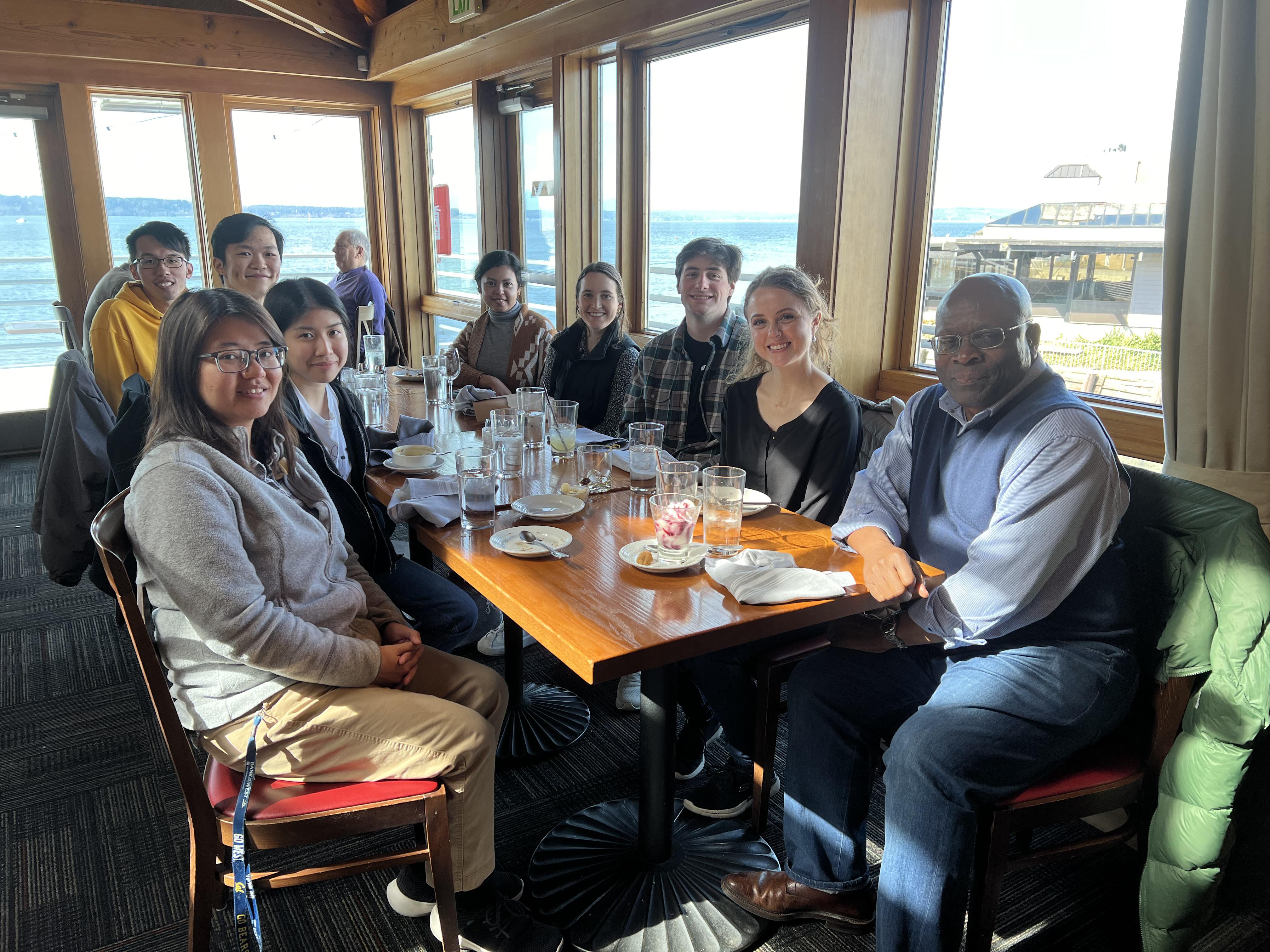 Professor Samson Jenekhe sitting at a table with a group of others