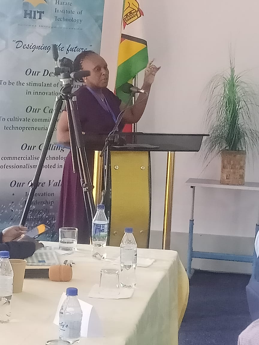 napreca-conference-in-zimbabwe---presenter-in-front-of-stand