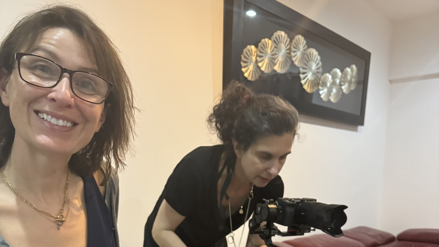 Professor Jennifer Leigh wearing glasses at a photo session for her work