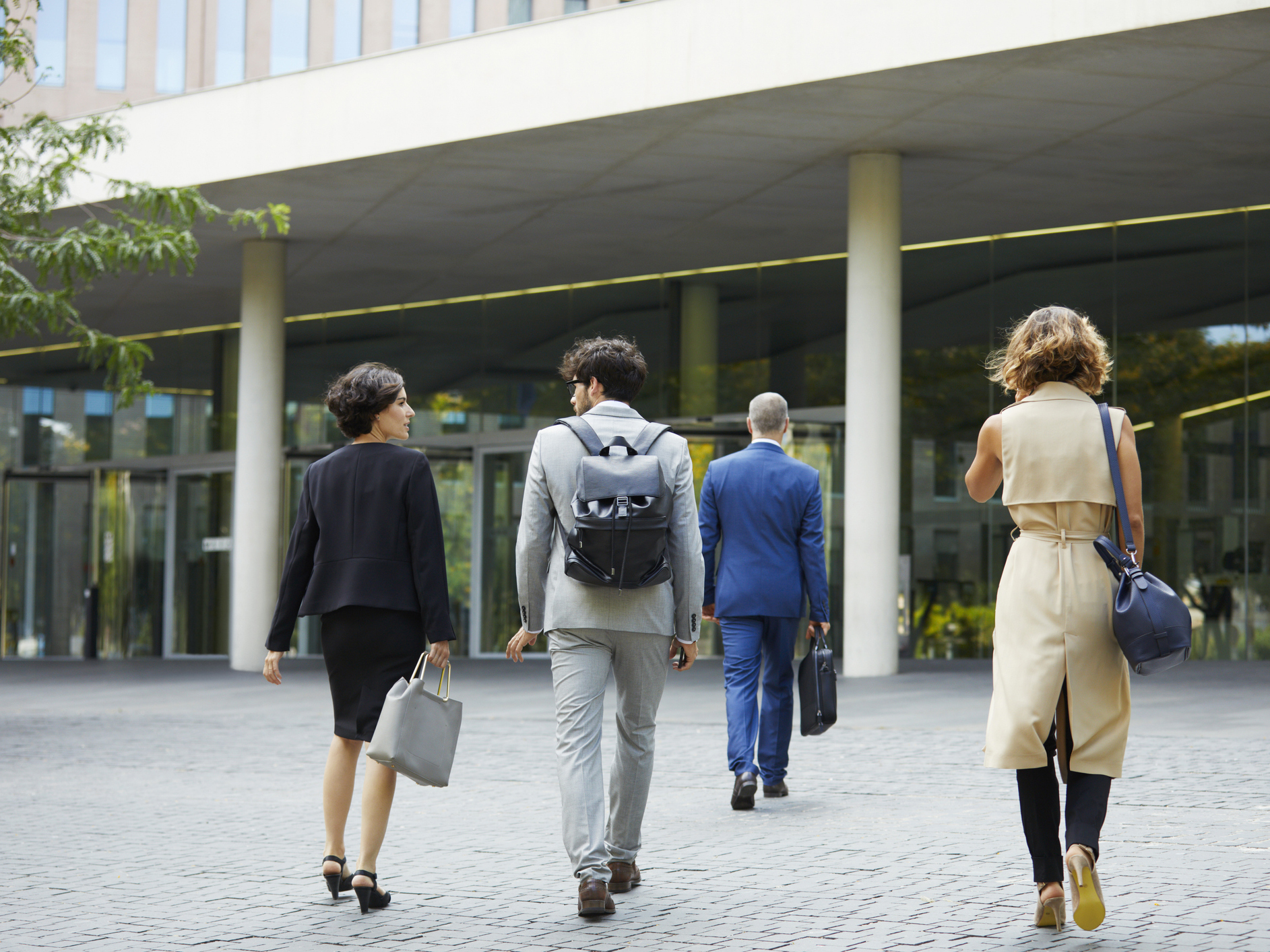 a group of people walking outside a building