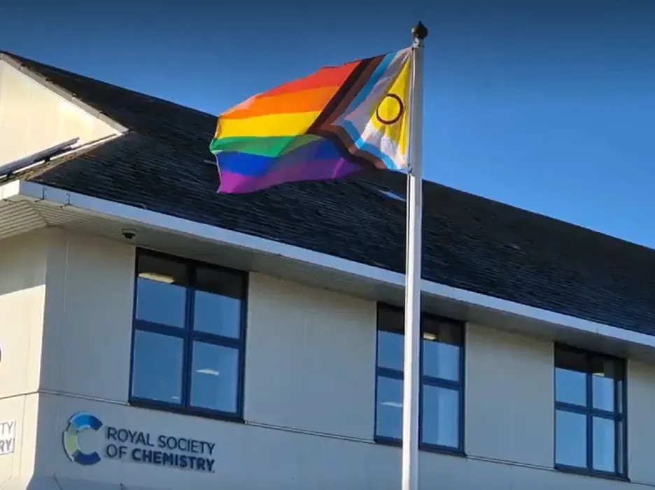 The Pride Flag flies alongside Thomas Graham House