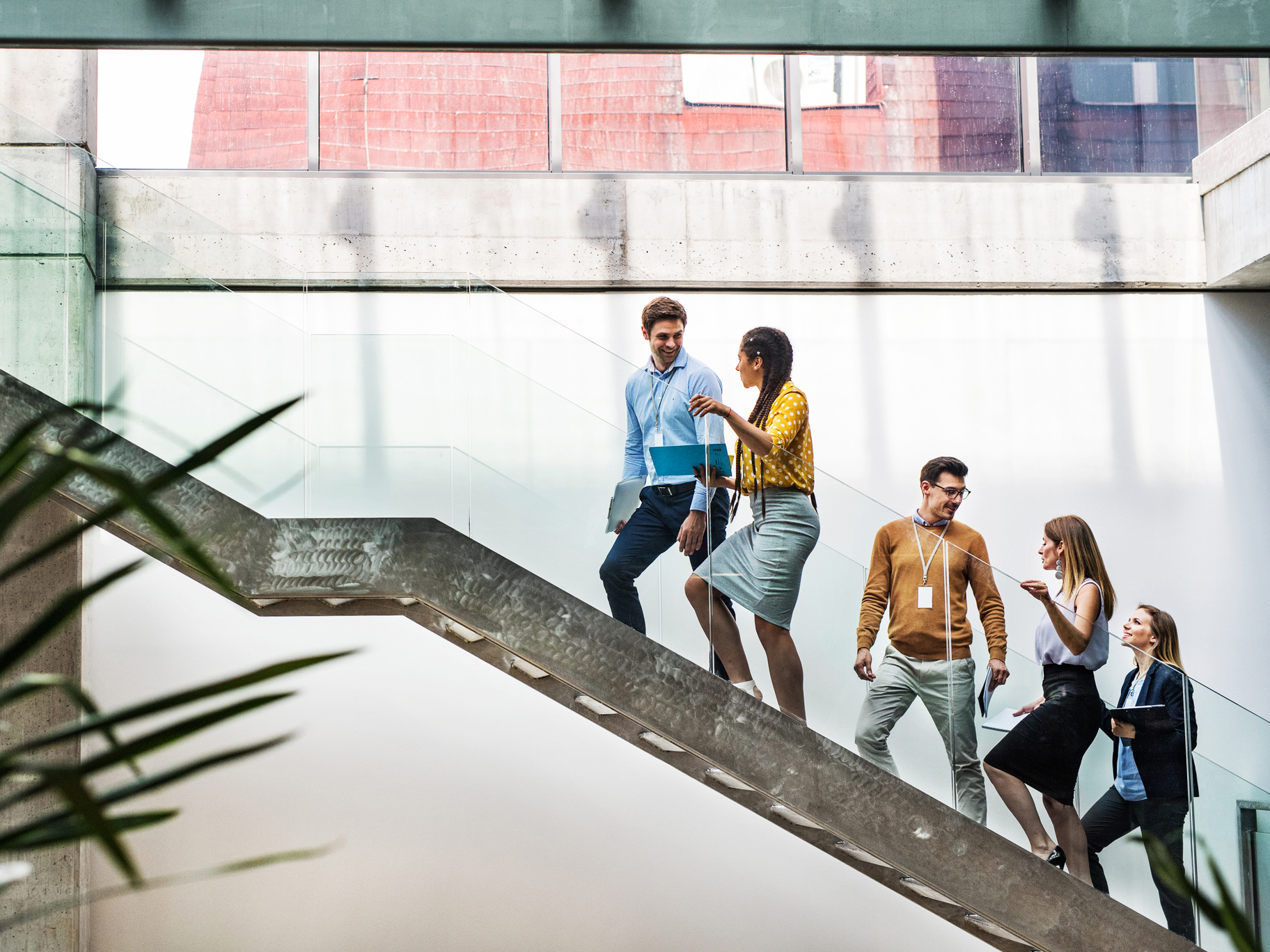 a group of people walking up a staircase