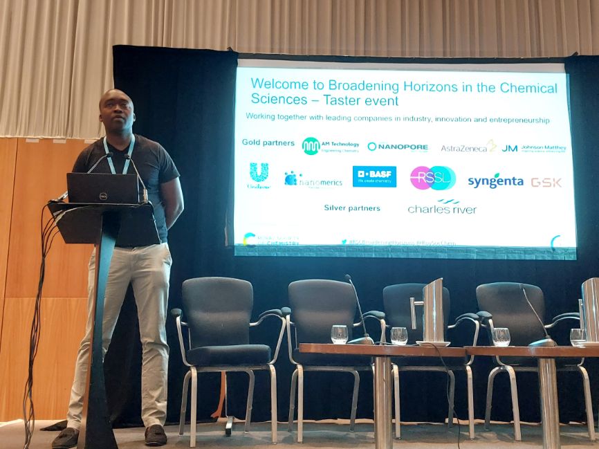 Dr Azzedine Dabo, of GSK, gives a presentation in front of an RSC screen promoting Broadening Horizons