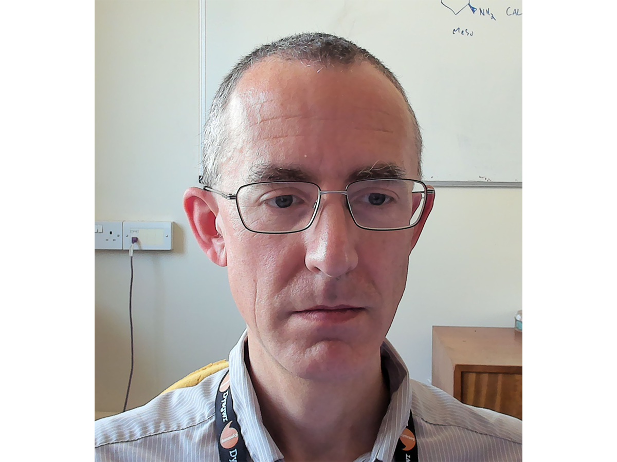 Headshot of Dr James Redman wearing glasses