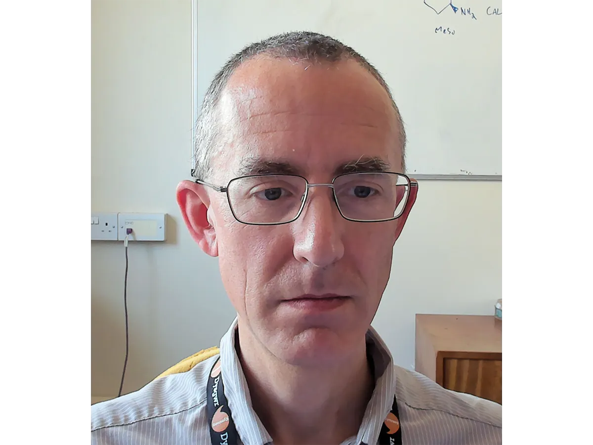 Headshot of Dr James Redman wearing glasses