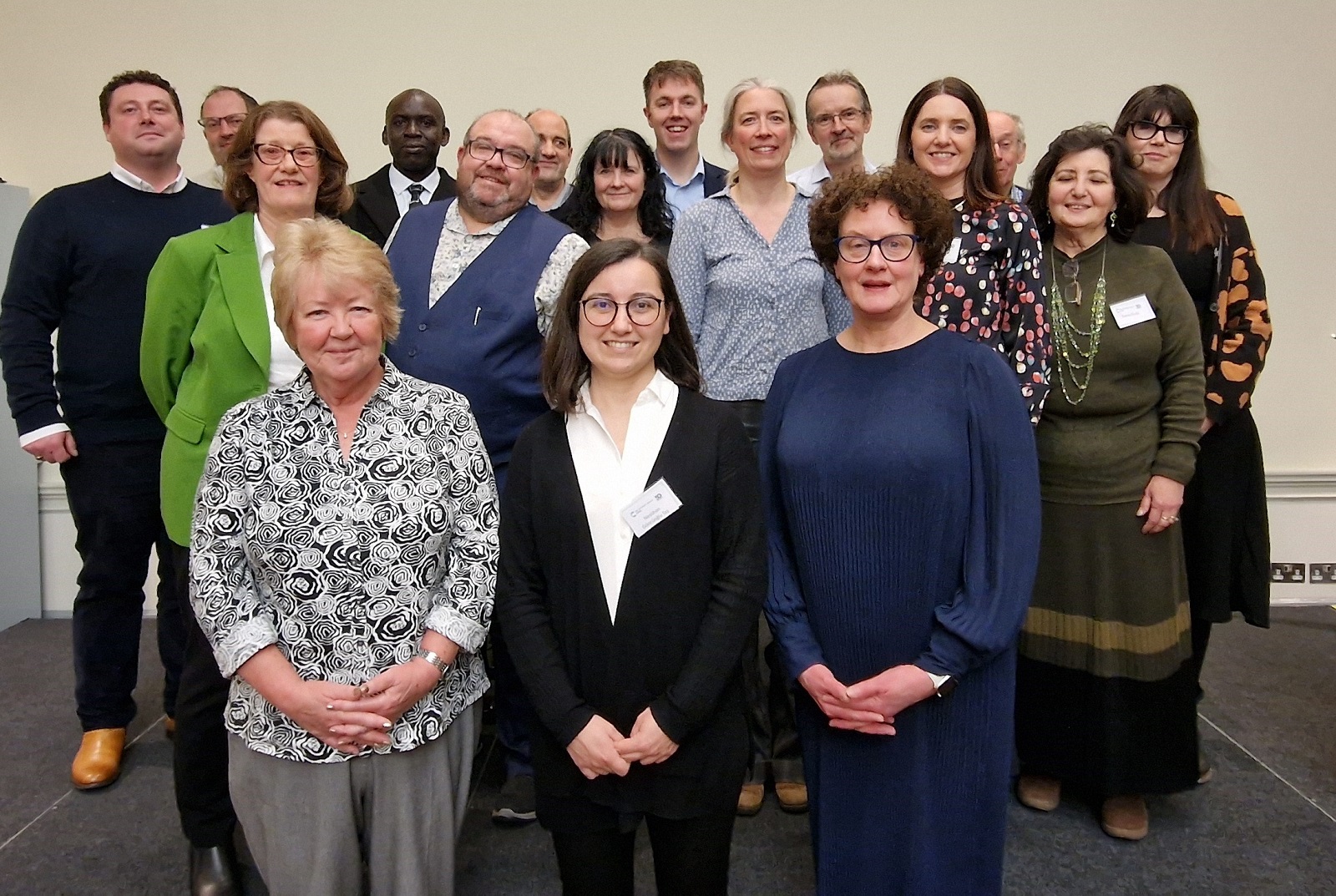 Sue Patel, Neslihan Taş and Dr Clare Hazel  (left to right) stand in front of the rest of the attendees at the RSC Food Group's 50th-anniversary celebrations