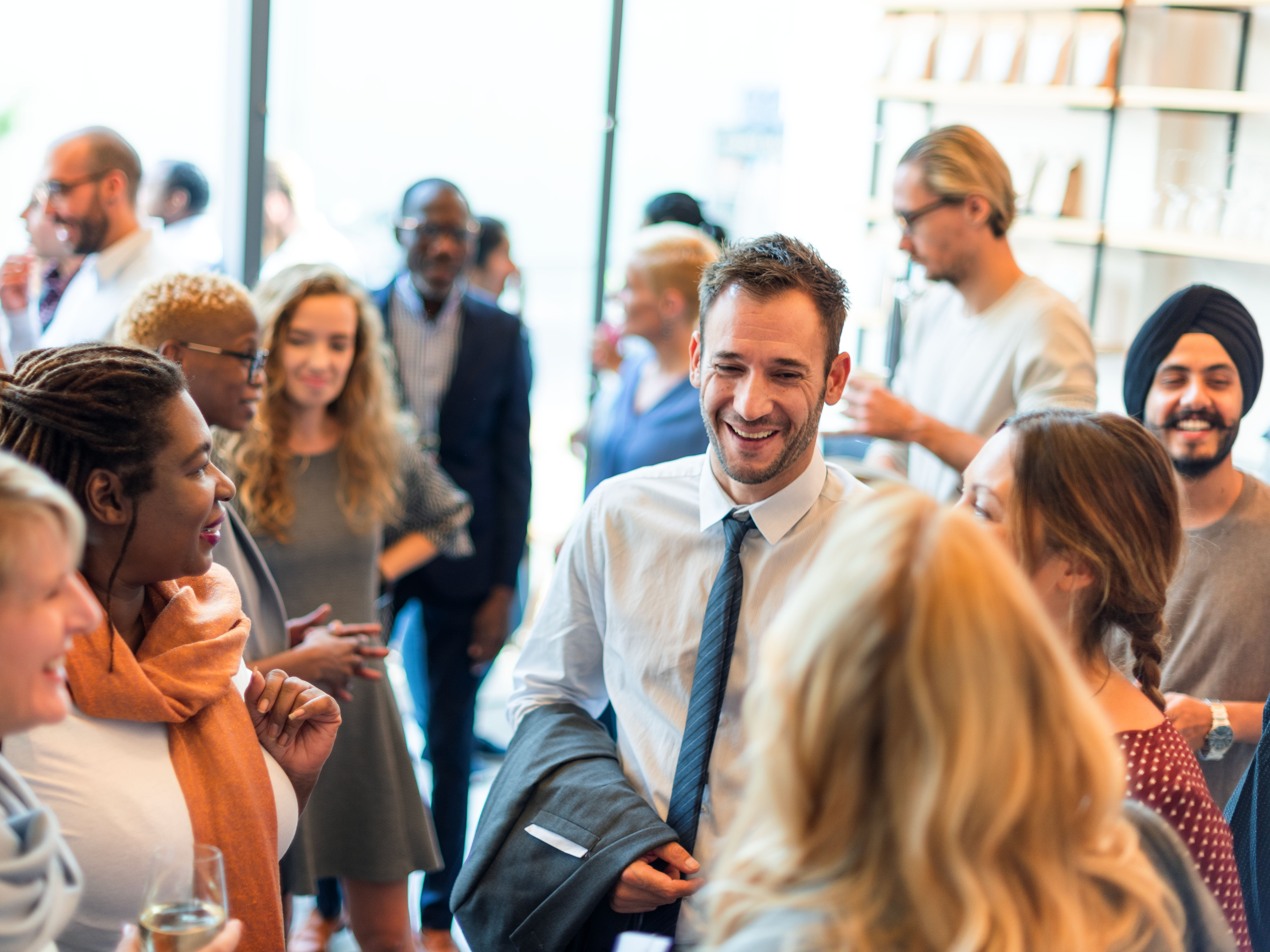 A group of people networking at an event