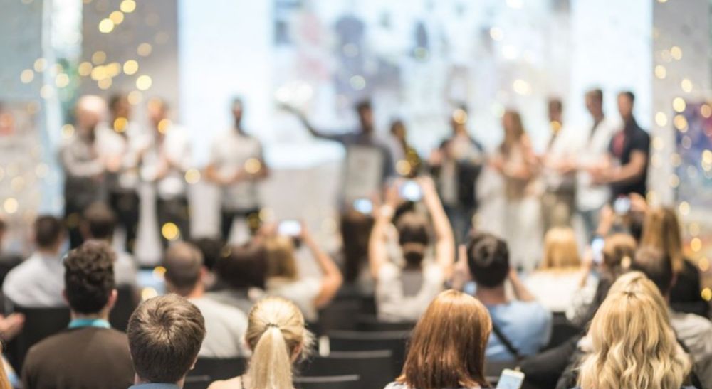 a group of people celebrating in a room