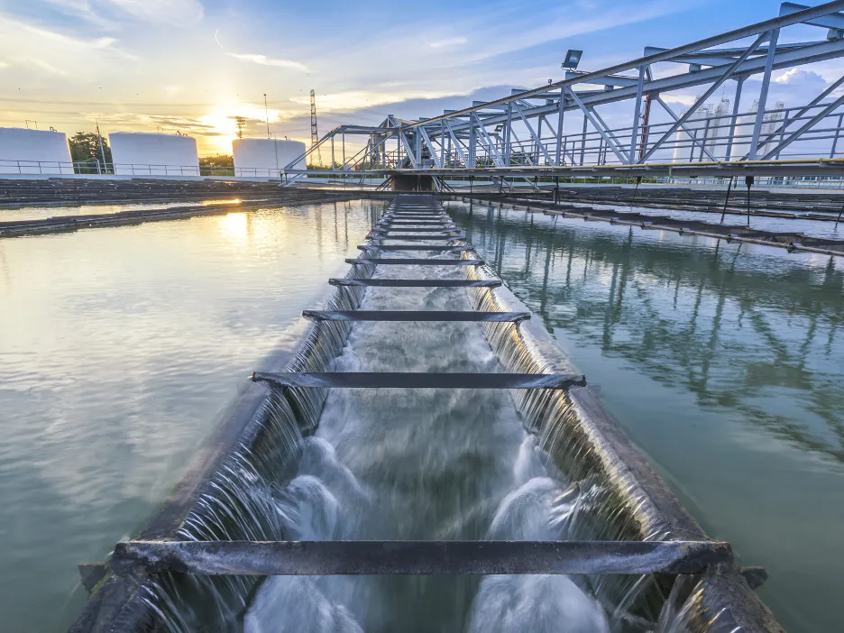 Water going into a large filter at a sewage treatment plant