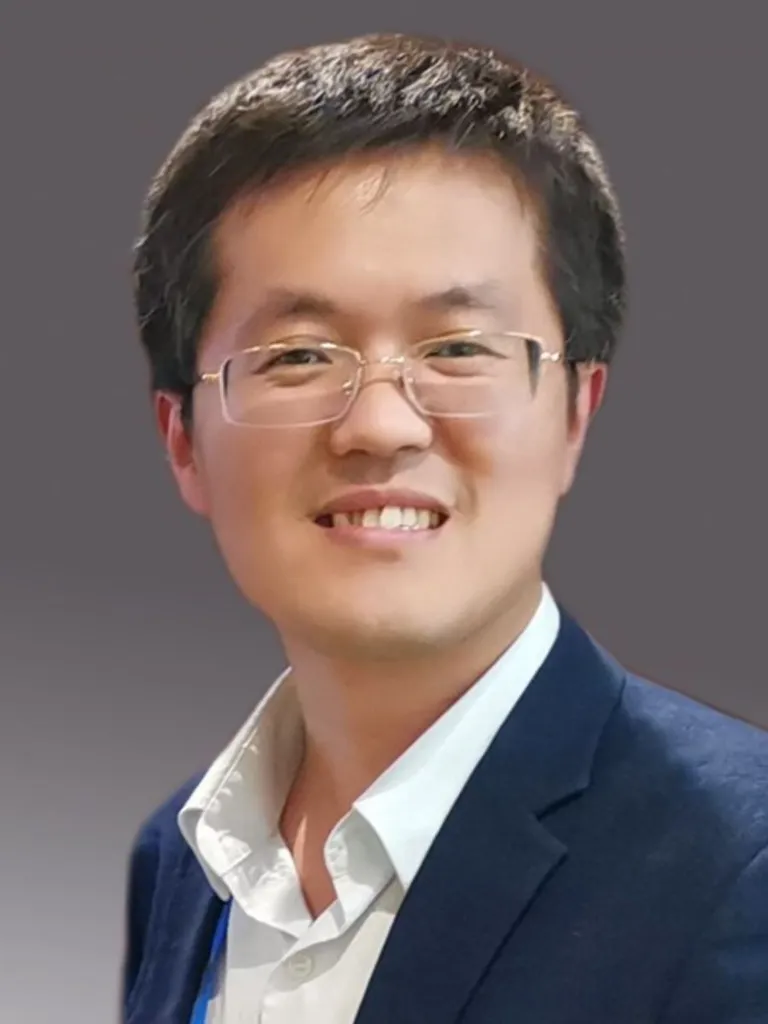 Professional head shot of Hai-Long Jiang in suit with open collar