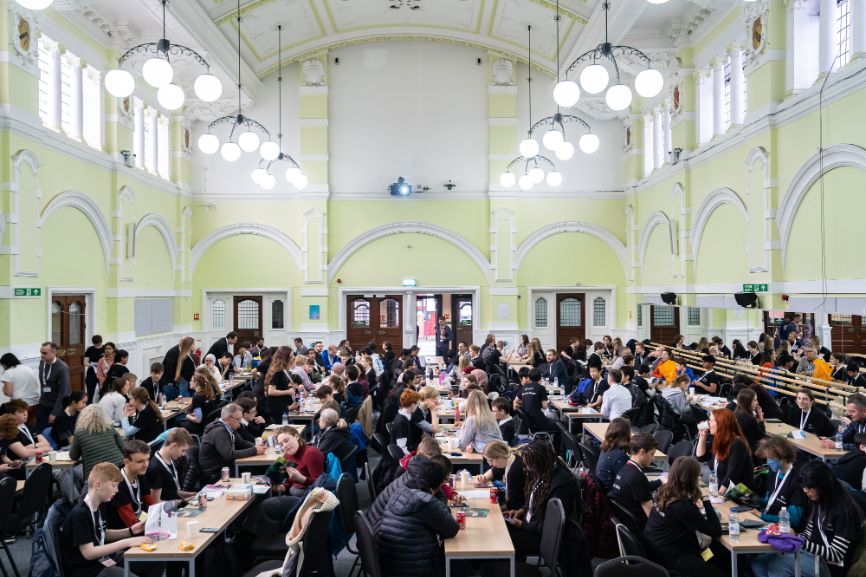 Students from the 31 teams pack a room at the University of East London for the Top of the Bench final