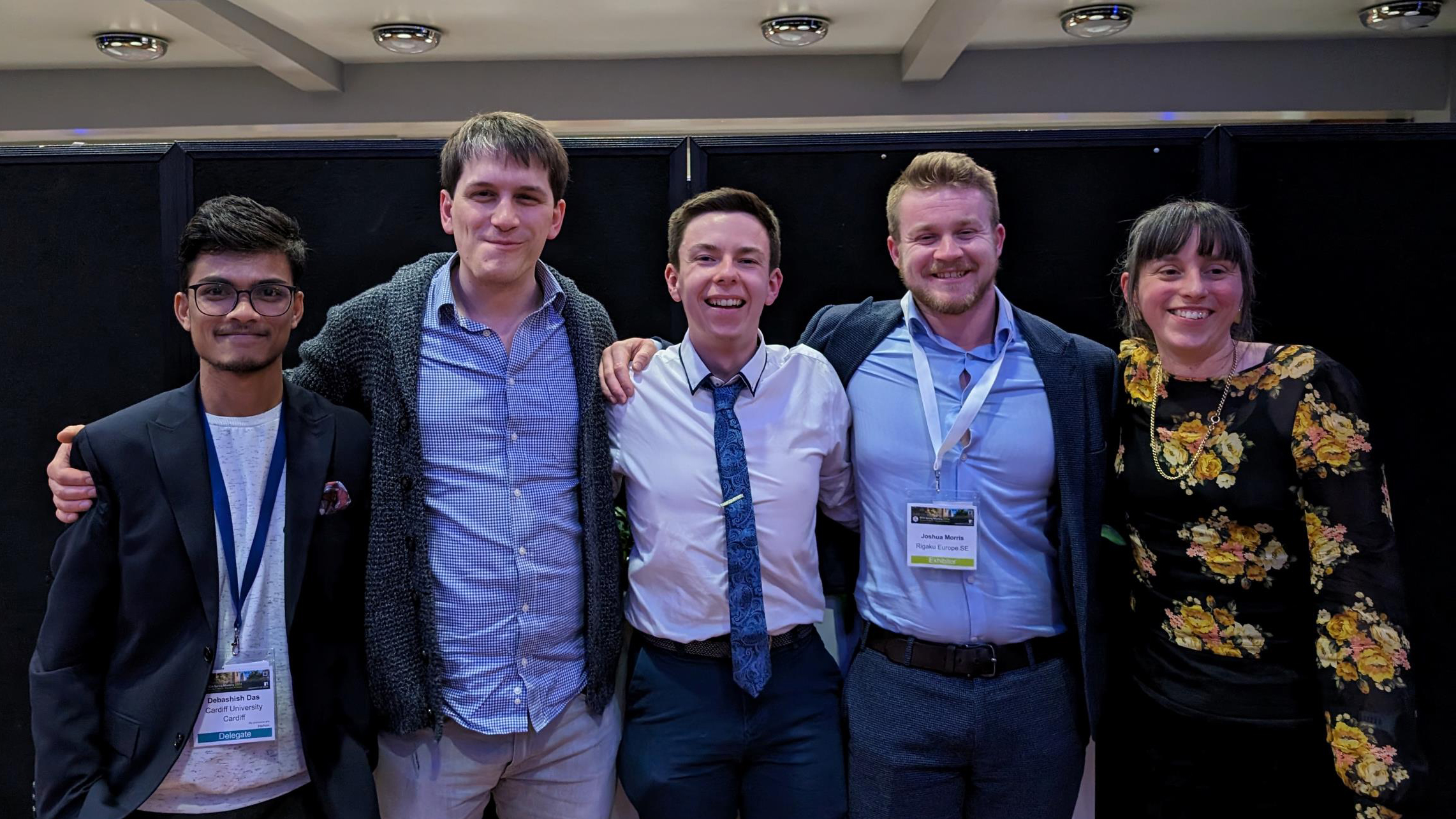Dr Lauren Hatcher with a group of people posing for a photo outside