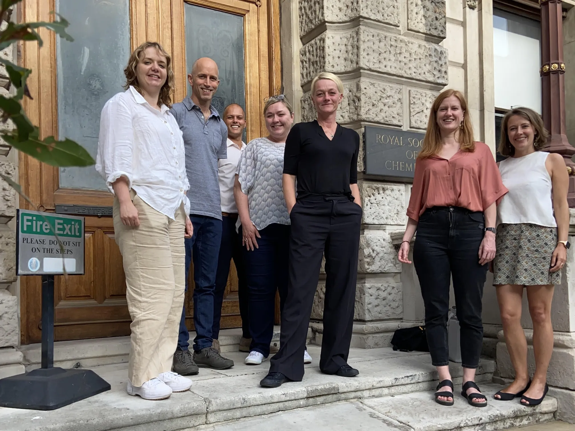 A group of seven people from the RSC OA focus group, including Sara Bosshart (far right) stand on the steps outside Burlington House