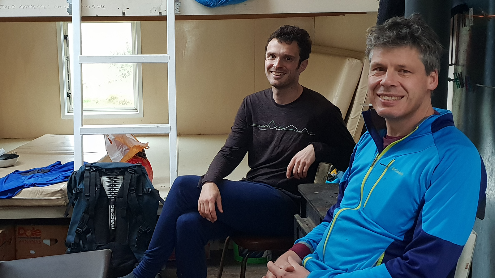Pioneers in Hybrid Glass Research team members sitting in a dorm room with bunk beds