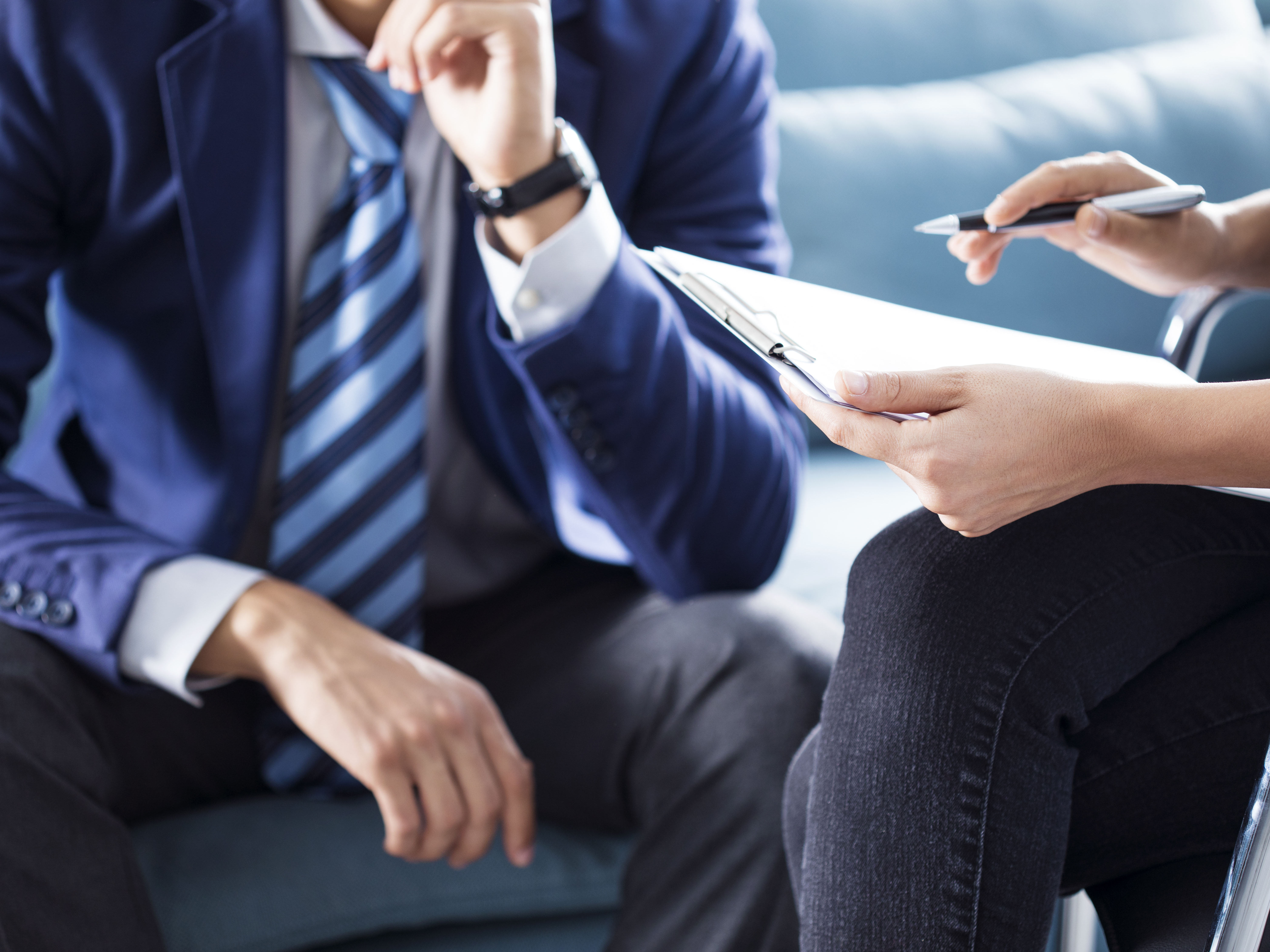 Two people discussing a plan or document