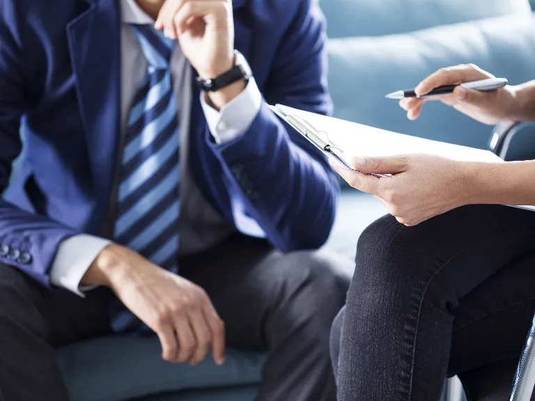 Two people discussing a plan or document