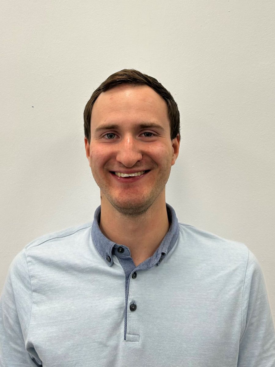 Dr Nathan Davison in blue shirt, smiling at the camera 900 x 1200 Teaser