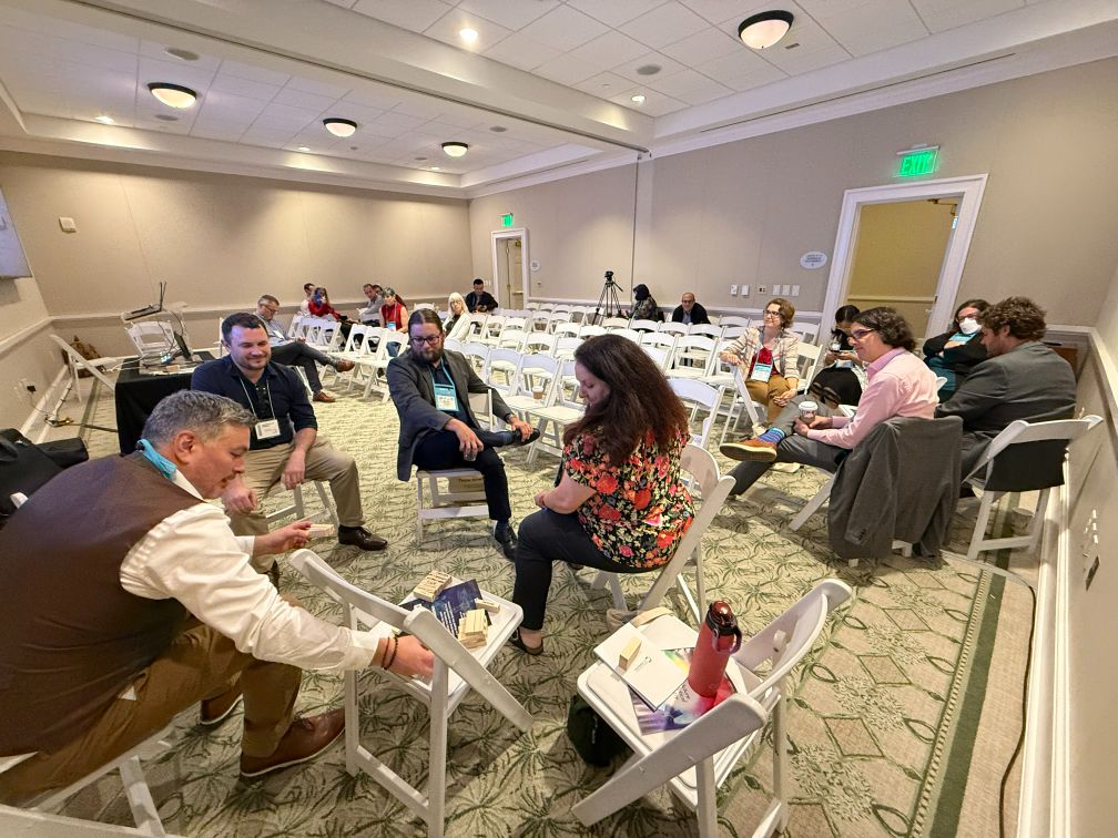 Group of people sitting at networking event