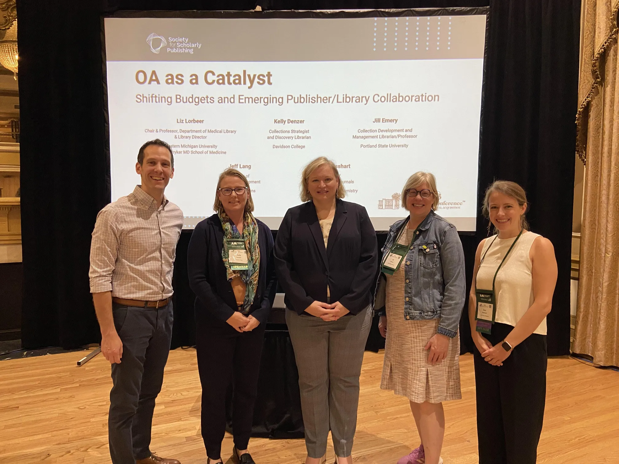 Five members of the RSC team stand in front of a screen that reads "OA as a catalyst" at an event in Charleston, South Carolina, USA