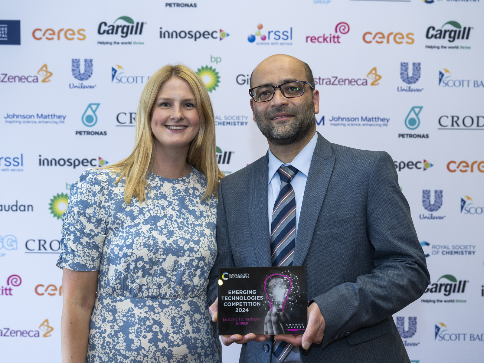Emerging technologies organiser Emily Vipond on the left, with Orthogonal Peptides was named the 2024 Enabling Technologies winner, with their representative Dr Othman Almusaimi on the right holding t