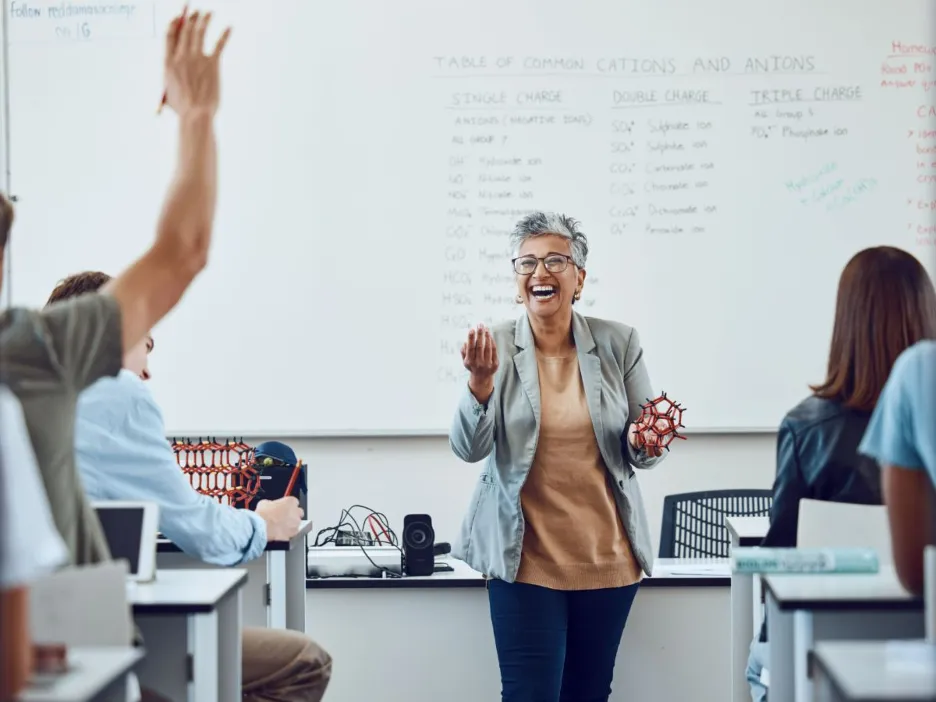 University teacher with students and chemistry models