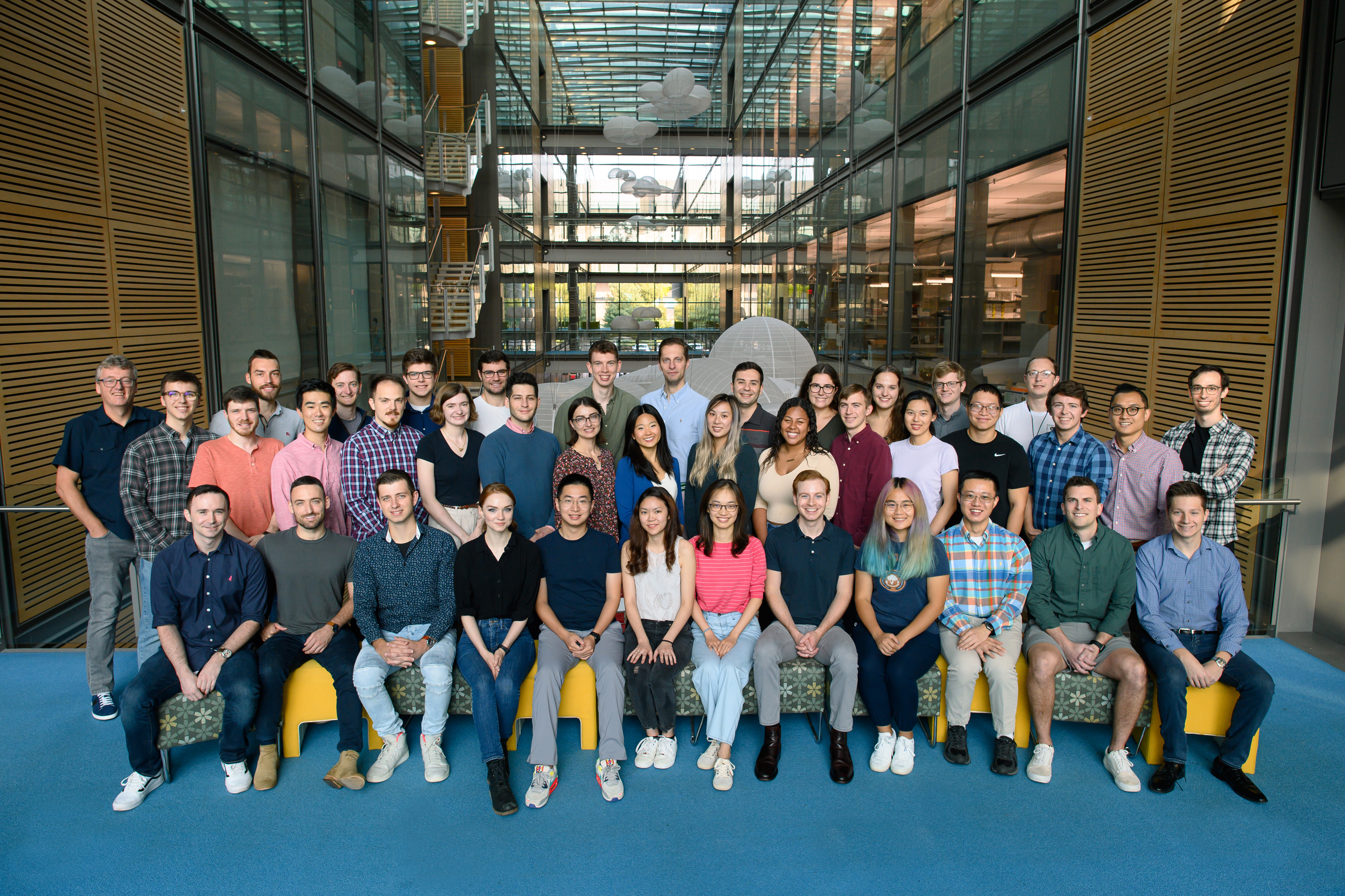 The image shows a group shot of the Macmillan research group