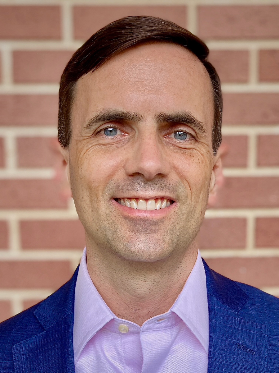 Head shot of Scott Lewis in suit