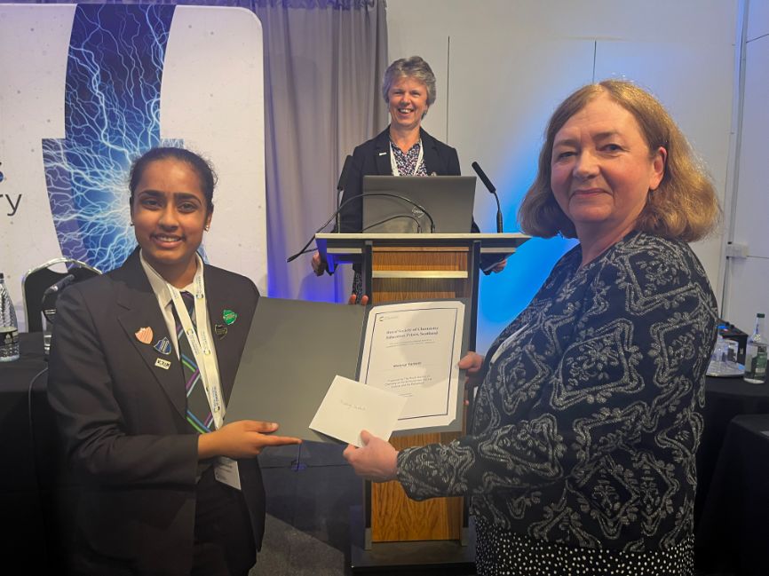 Professor Julie Fitzpatrick, Scotland's chief scientific adviser (pictured right), presents an award to one of the many science award winners commended at the Science and the Parliament event, whi