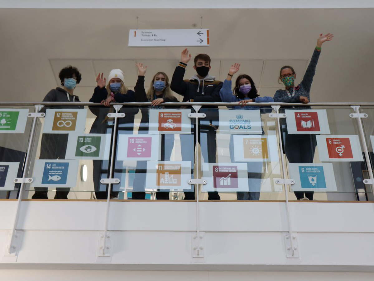 Group of students with images of the United Nations sustainability goals