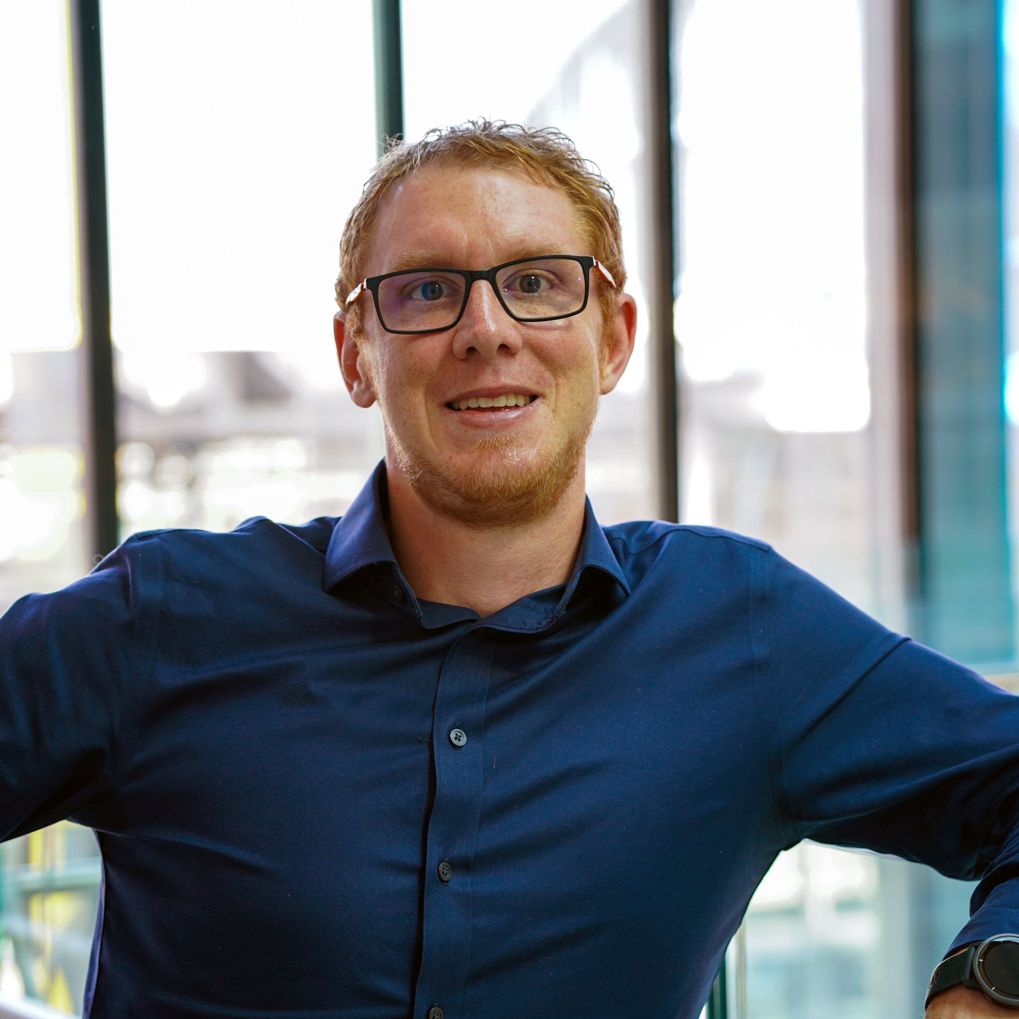 A headshot of Dr Benjamin Schumann.