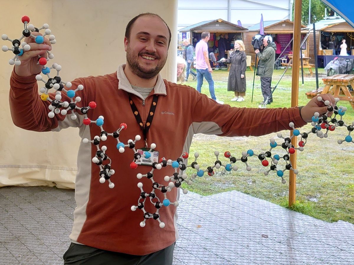 Protein model Eisteddfod Professor at Eisteddfod festival tent with a ball and stick protein model