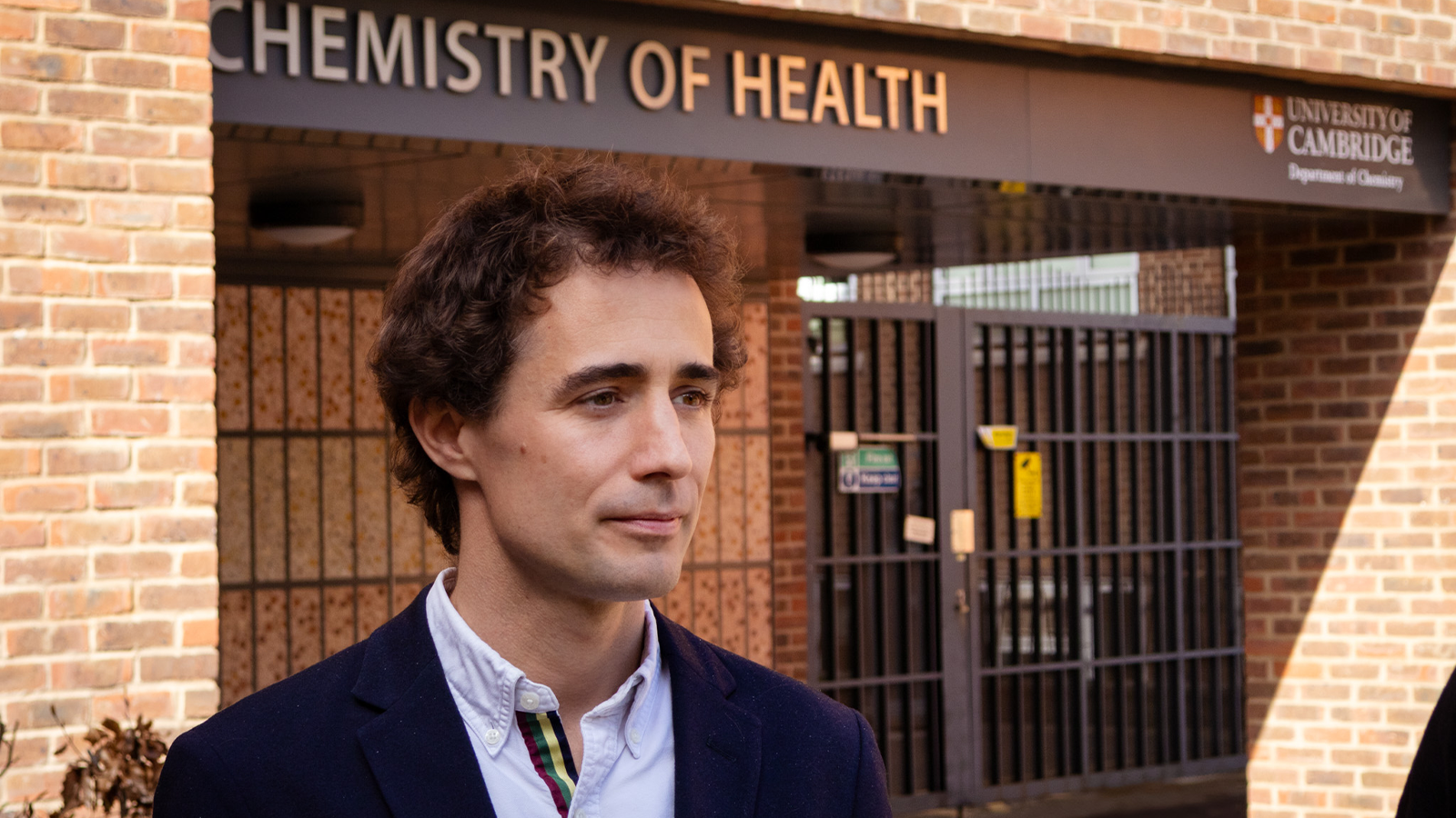 Dr Pietro Sormanni standing outside of a building in shirt and suit jacket