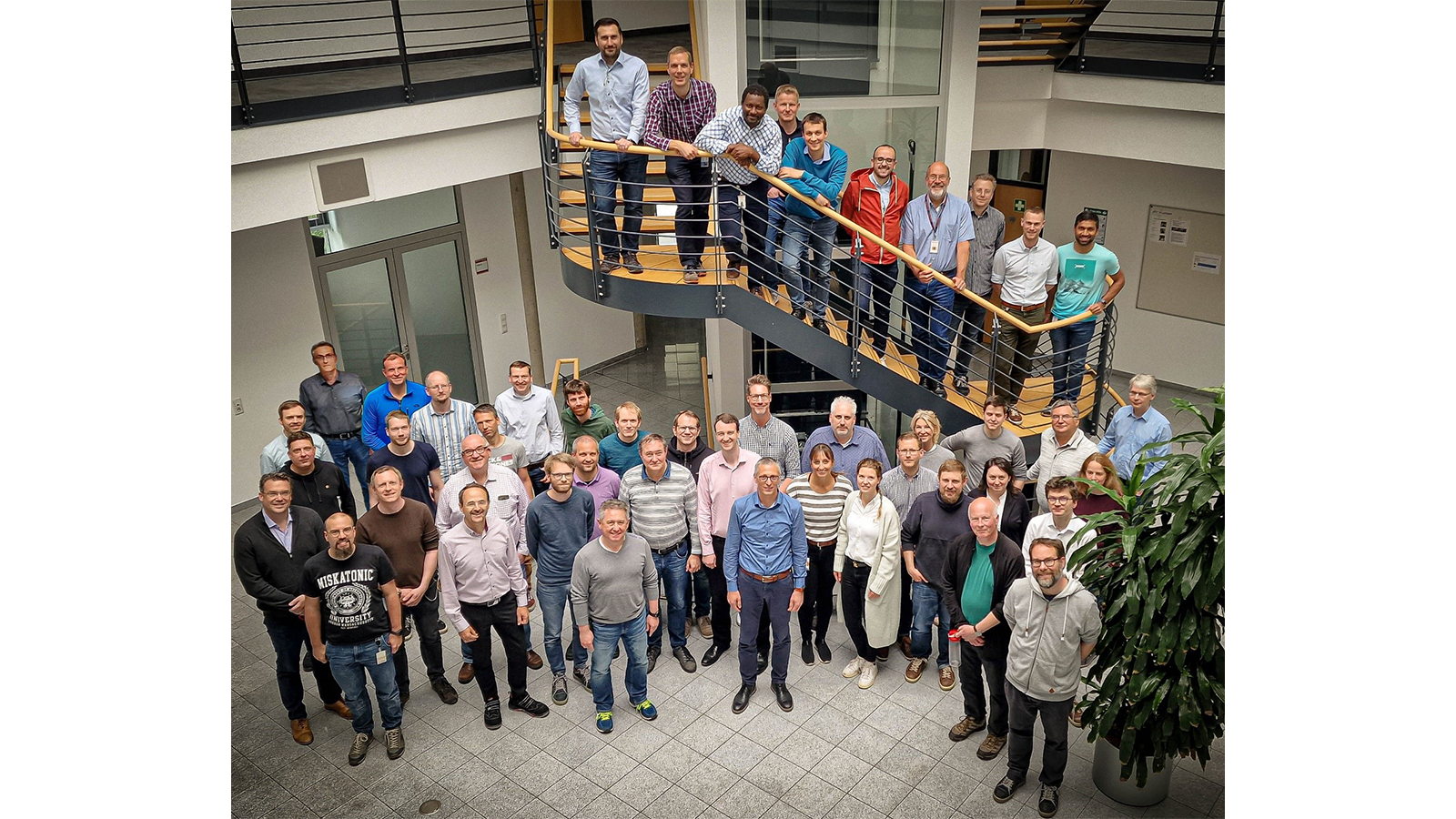 Orbitrap Astral Team members standing on a staircase in the Orbitrap Astral Team building