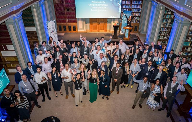 group of people standing in auditorium
