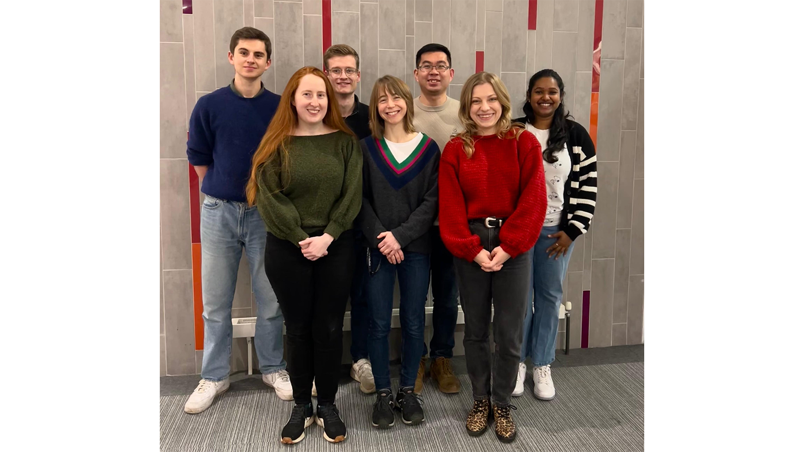 Dr Fanran Meng and colleagues standing as a group smiling for the camera