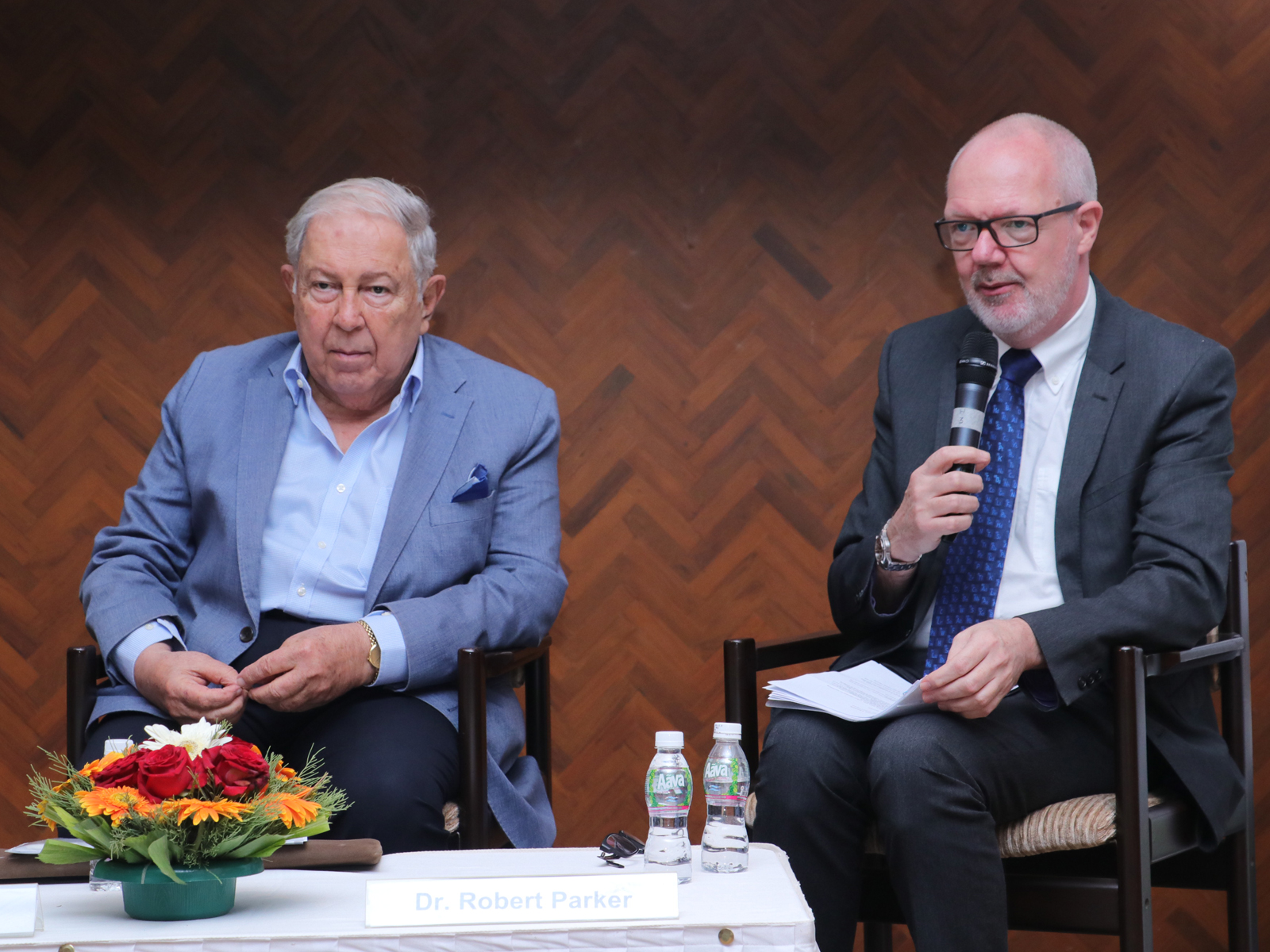 Image of Yusuf Hamied and Robert Parker seated at a press conference © Royal Society of Chemistry