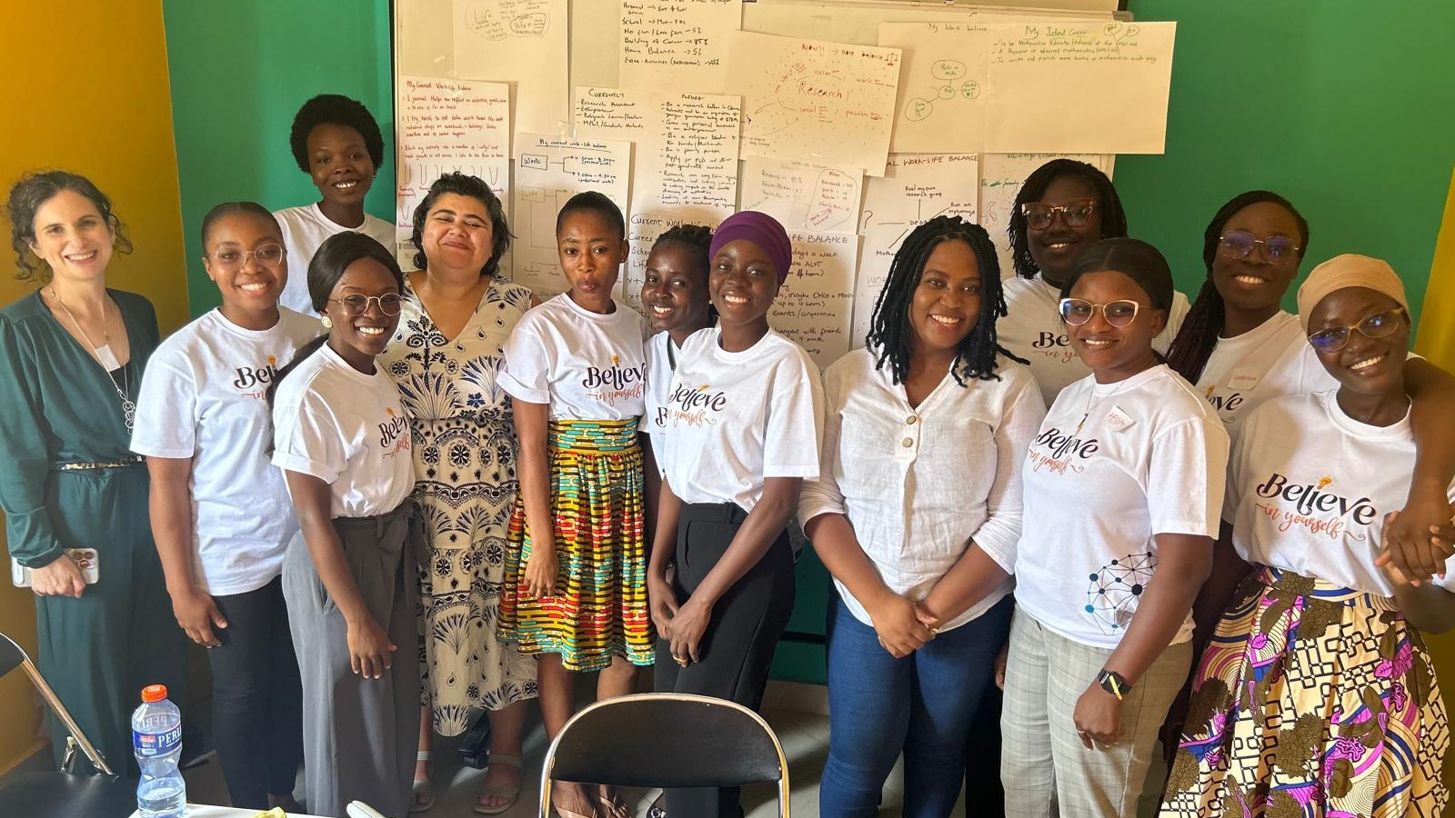 Professor Jennifer Leigh with a group of Black students, some in African dress