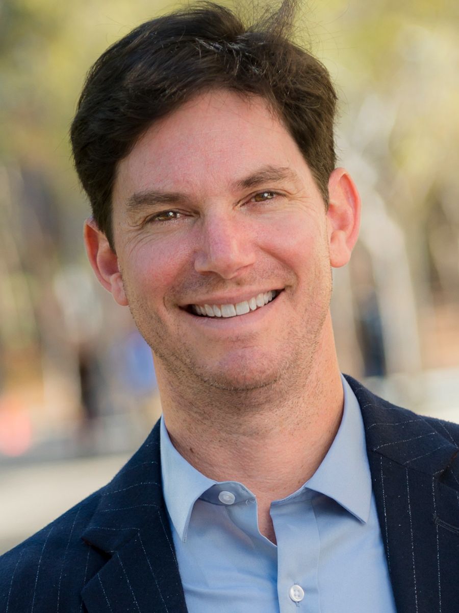 Professor Seth Cohen smiling for camera