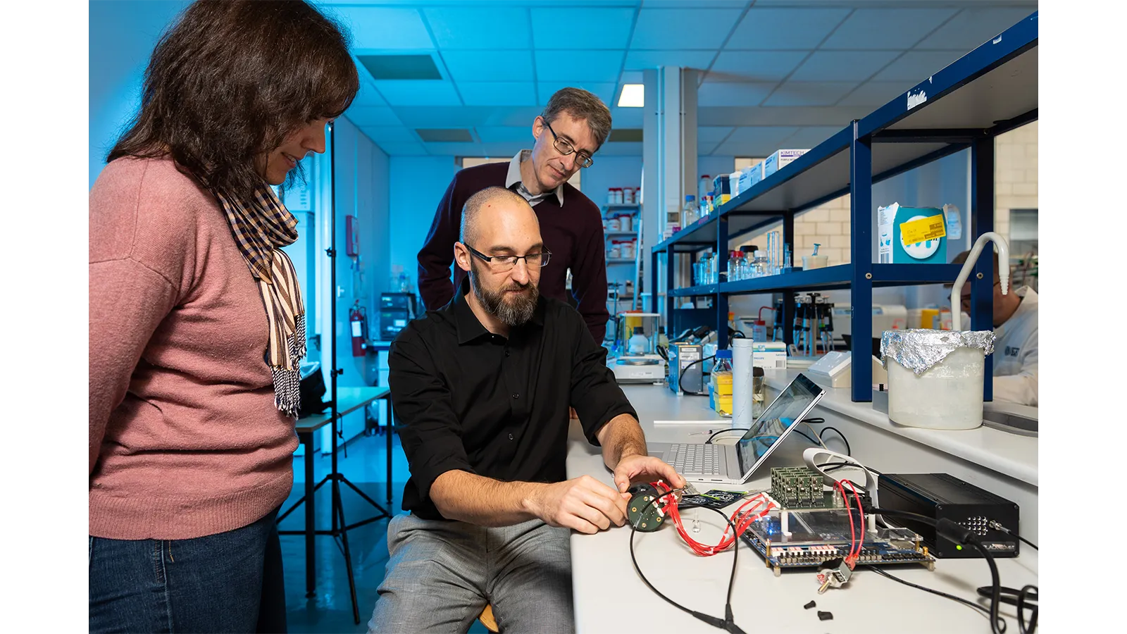 Harm Reduction standing with their equipment in a lab