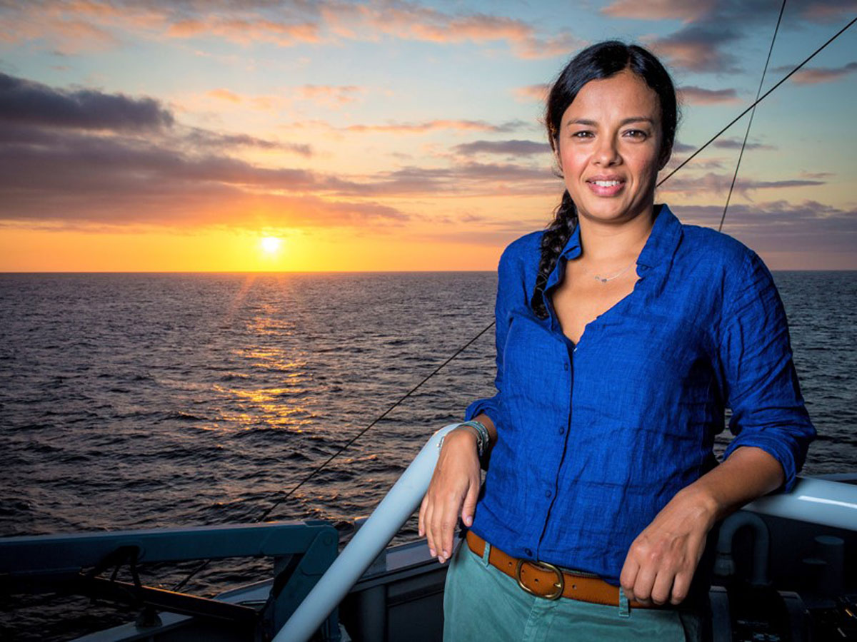 Liz Bonnin posing on a boat in front of the sunset 