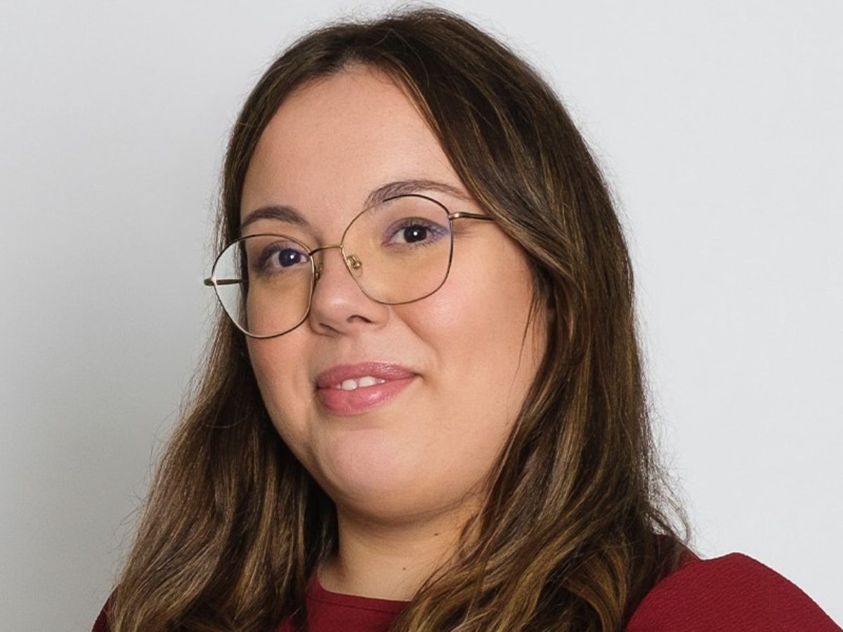 A portrait picture of Dr Natércia das Neves Rodrigues Lopes wearing glasses and a red jumper A portrait picture of Dr Natércia das Neves Rodrigues Lopes wearing glasses and a red jumper