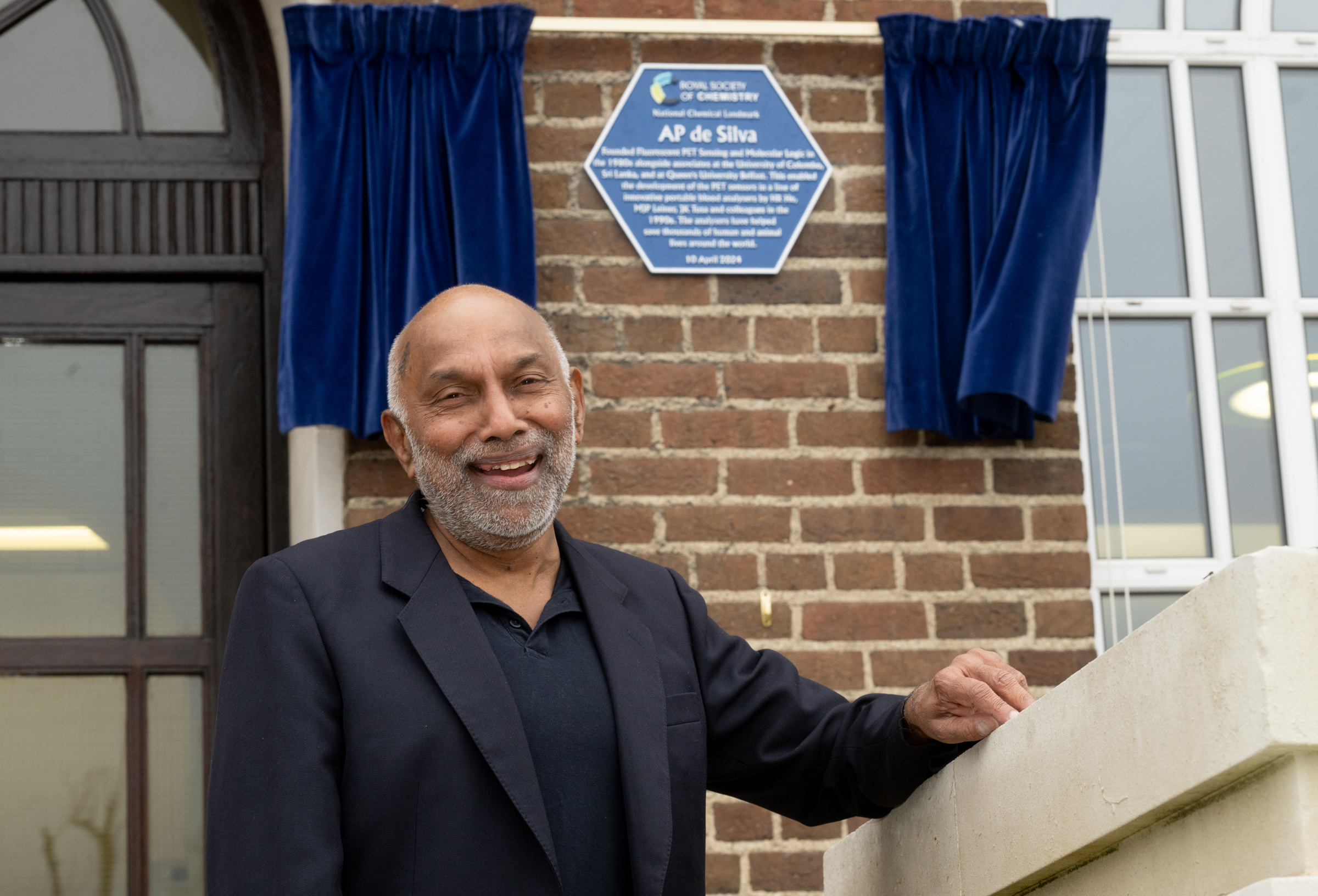 Prof AP de Silva smiles in front of his National Chemical Landmark plaque at Queen's University Belfast Prof AP de Silva smiles in front of his National Chemical Landmark plaque at Queen's University Belfast