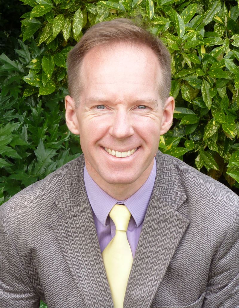 Peter Clarke profile image with green background