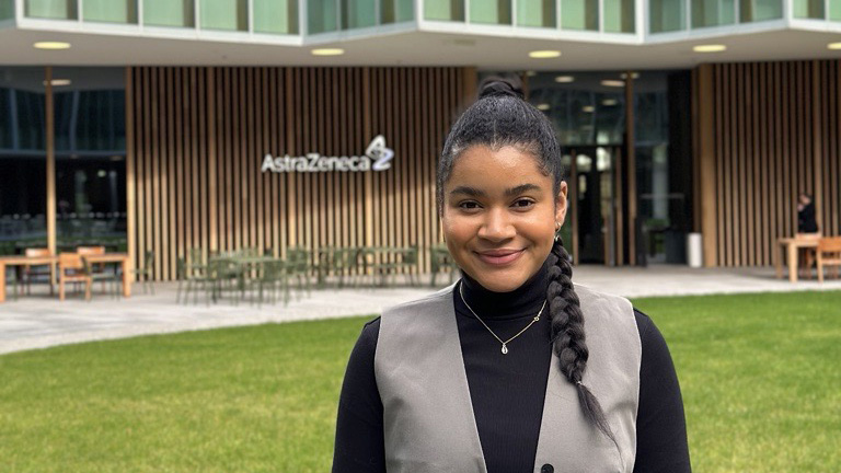 Christina Dumitriu Jackson outside a building smiling for teh camera