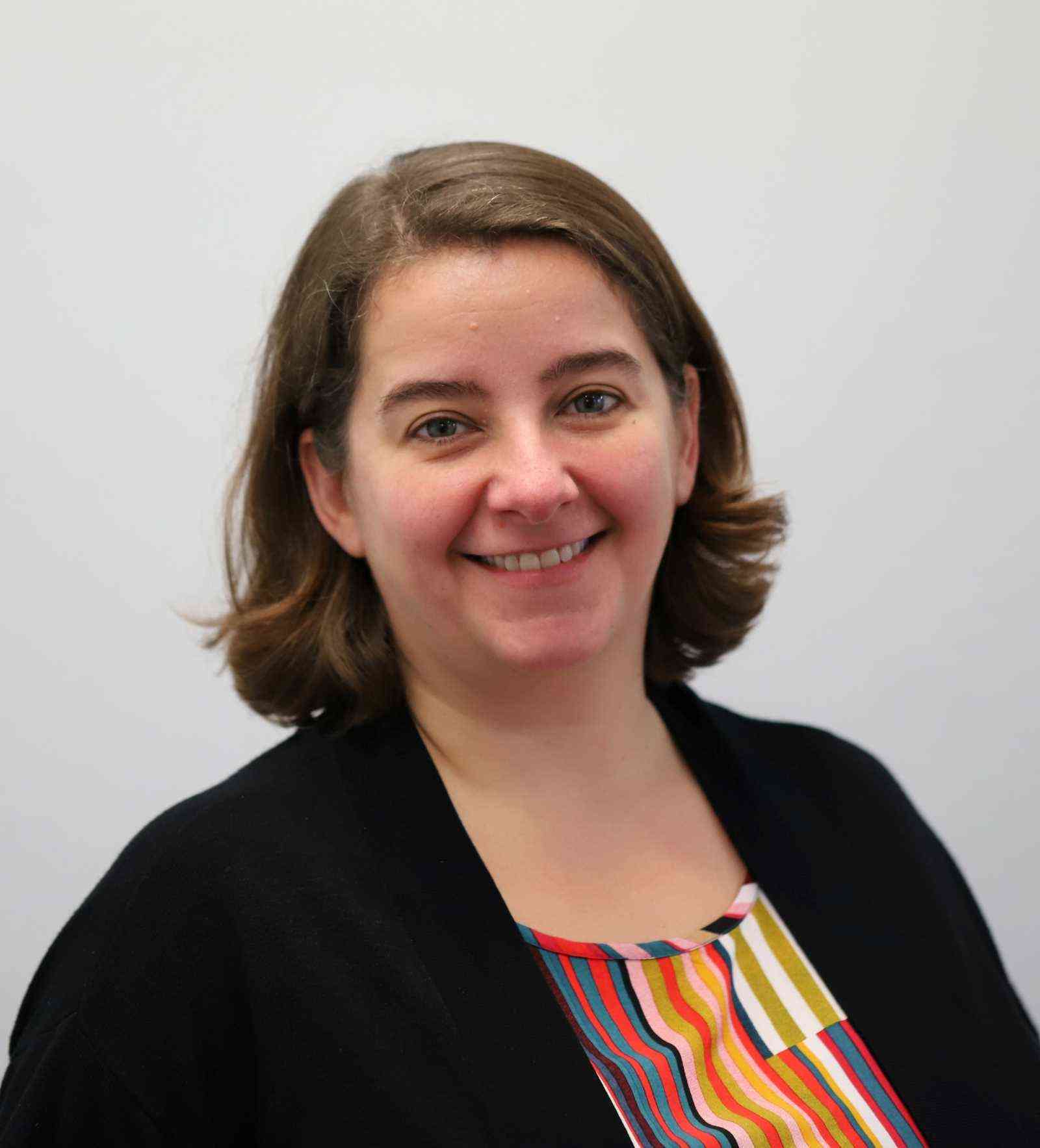 Nicola Nugent is pictured smiling in a headshot